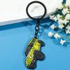 A yellow and black Ford Bronco zinc alloy keychain attached to a black ring.