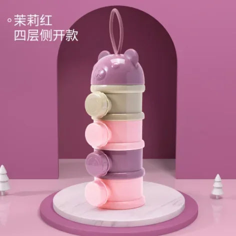 A stack of three pink and purple bear-shaped baby food storage containers.