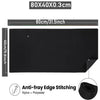 Black anti-fray edge stitched mouse pad measuring 80x40cm