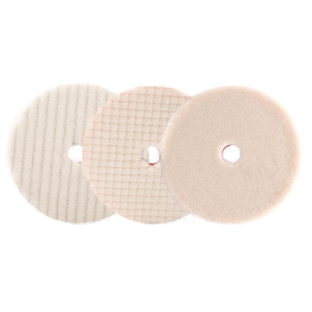 Three round wool polishing pads of varying textures and shades of beige for deep scratch and oxidation removal
