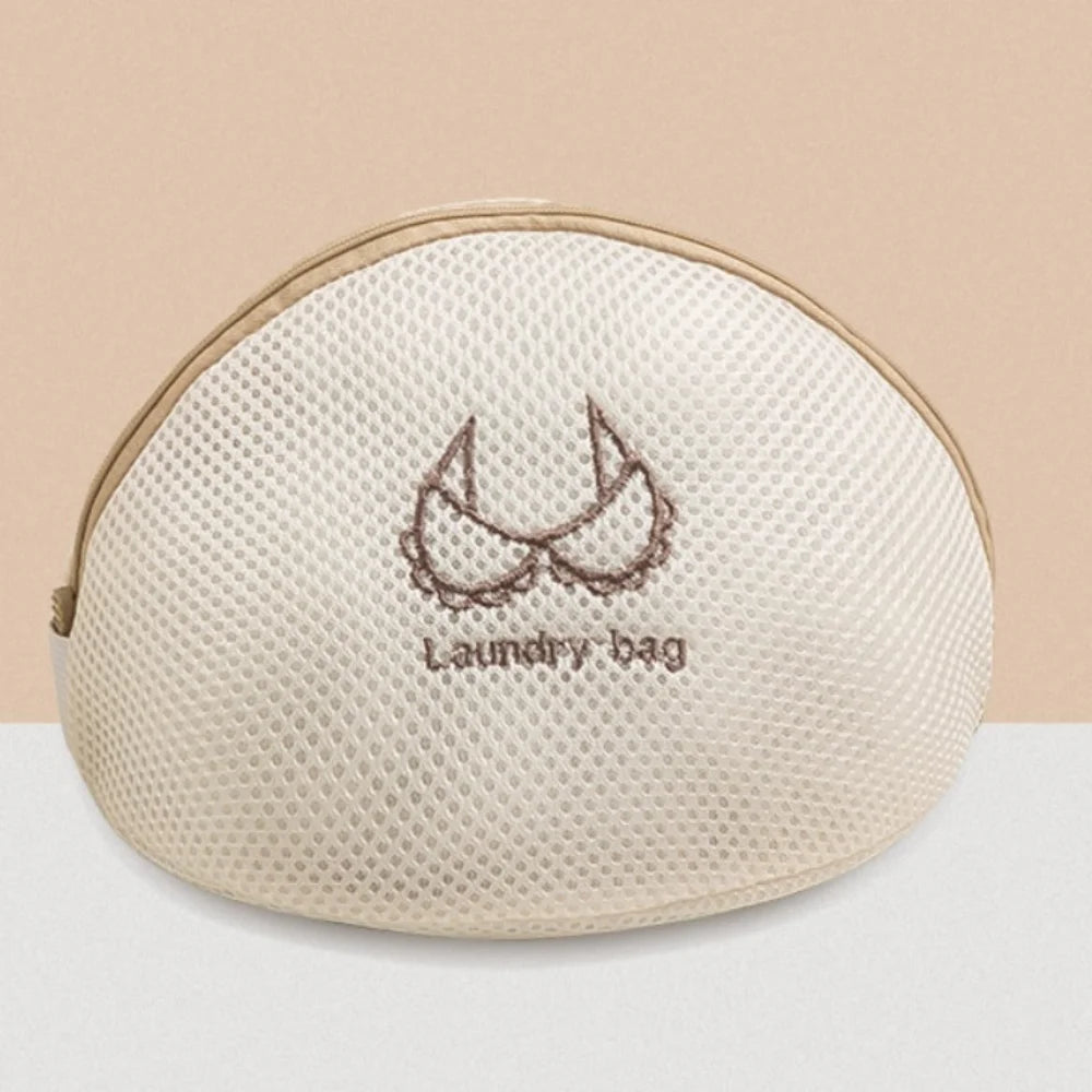 Beige wiederverschließbare Wäschetasche mit zarter Blumenstickerei.