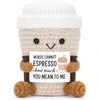 A handcrafted crocheted plush ornament shaped like a face with brown and cream yarn.