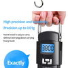 A black digital luggage scale is shown hanging by a hook, displaying a weight of 3.800 and featuring an LCD screen.