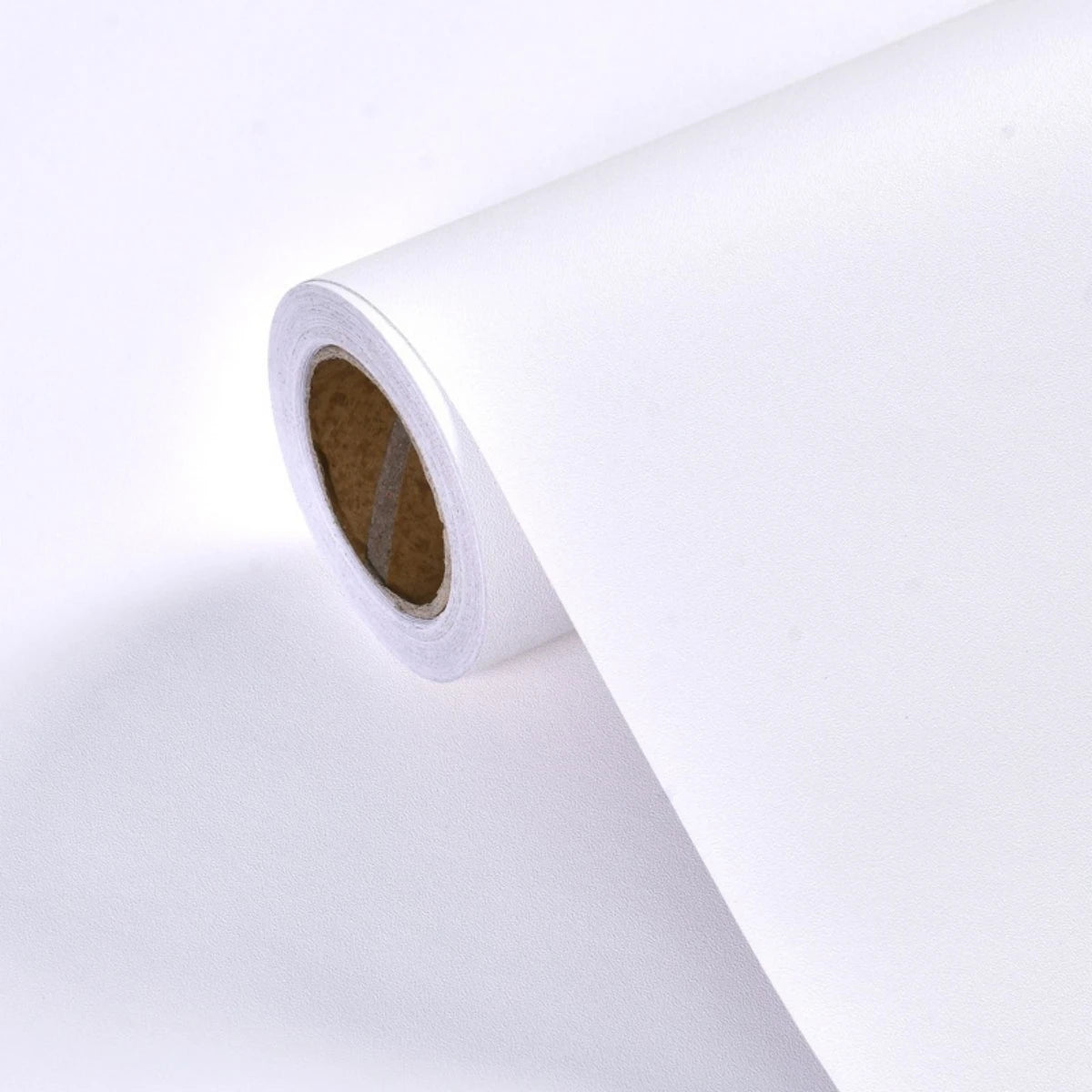 Roll of self-adhesive matte green vinyl film for furniture and wall renovation