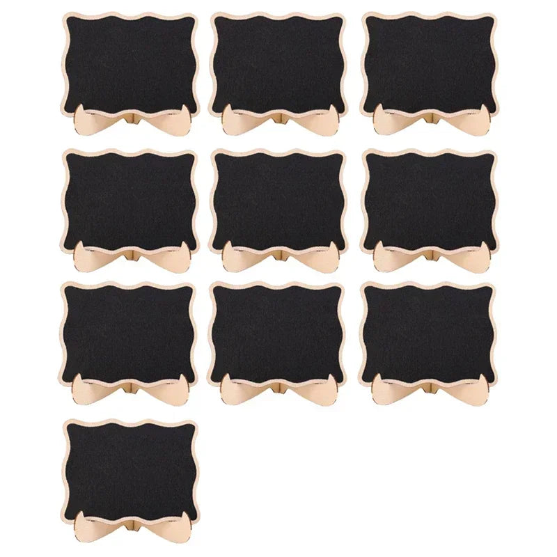 A set of twelve mini wooden chalkboard signs with a black surface and light wood trim.