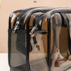 A clear, black and brown transparent PVC toiletry bag designed for dry and wet separation storage.