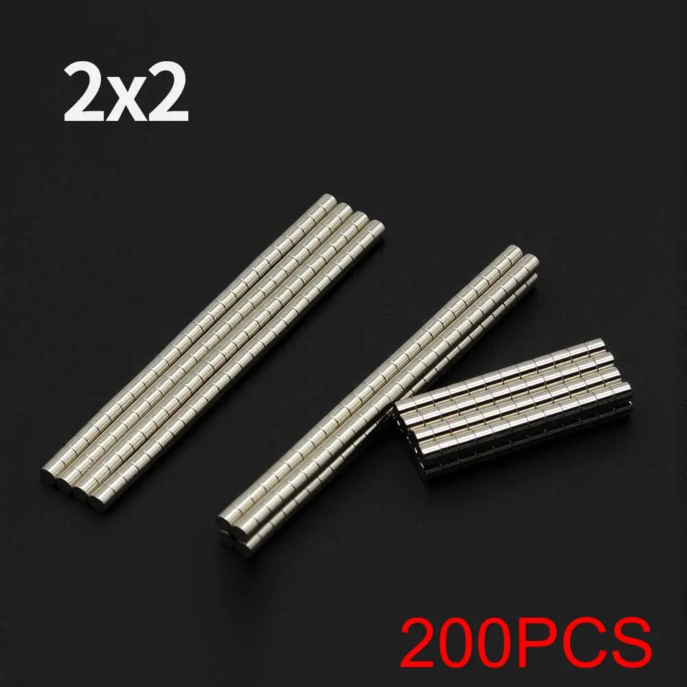 A collection of 200 pieces of 2x2 disc neodymium magnets arranged in parallel strips.