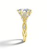 A gold filled moissanite engagement ring featuring a marquise cut stone surrounded by nature-inspired diamond accents.
