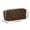 A brown leopard print double-zip pencil case with a gold zipper and dimensions of 21cm x 10cm.