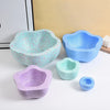 A set of five colorful, textured plastic stepping stones for kids' sensory and motor skills development.