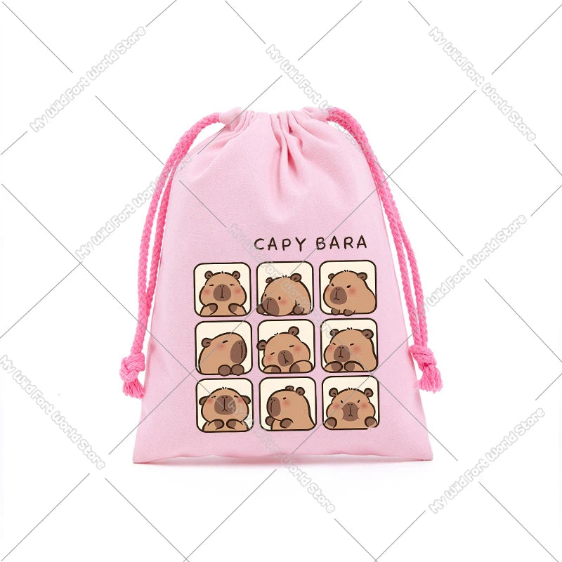 Pink drawstring storage bag featuring multiple cute capybara face patches.