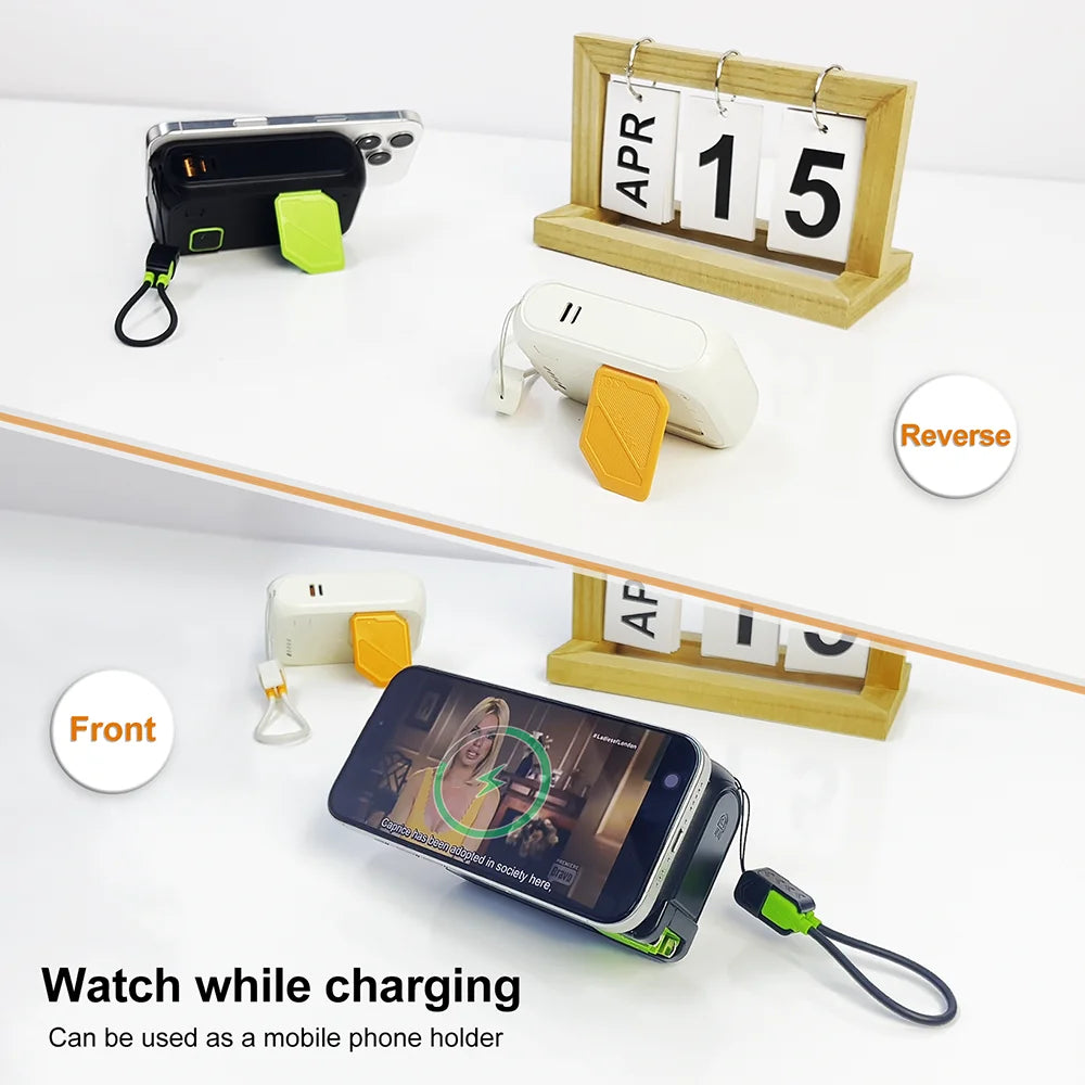 A power bank and mobile phone holder are shown on a white surface, demonstrating the ability to watch while charging.