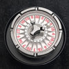 Close-up view of a metal roulette dice with numbered fingers for tabletop games