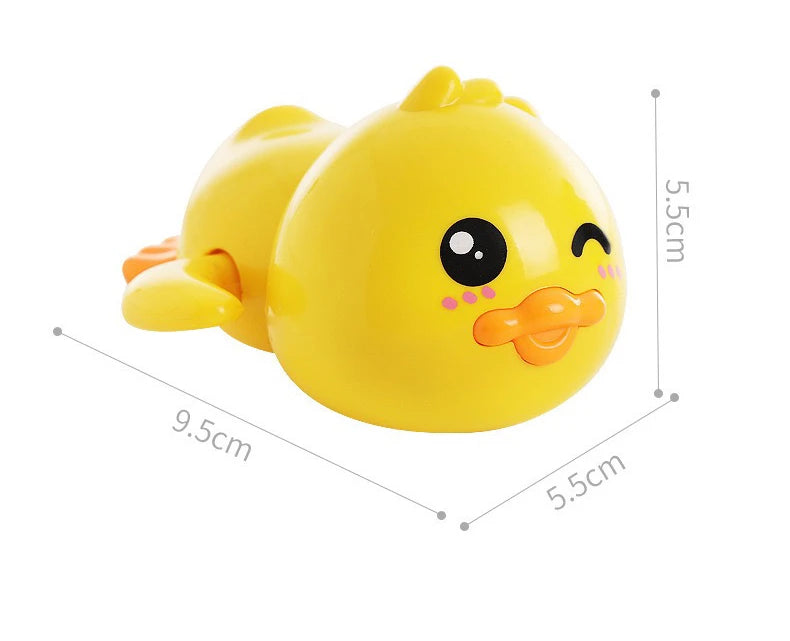 A bright yellow wind-up bath toy duck with a smiling face and orange beak.