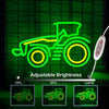 Adjustable brightness neon sign of a tractor in green and yellow light displayed on a grid background.