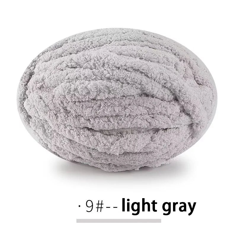 A ball of light gray extra thick chenille yarn for hand knitting