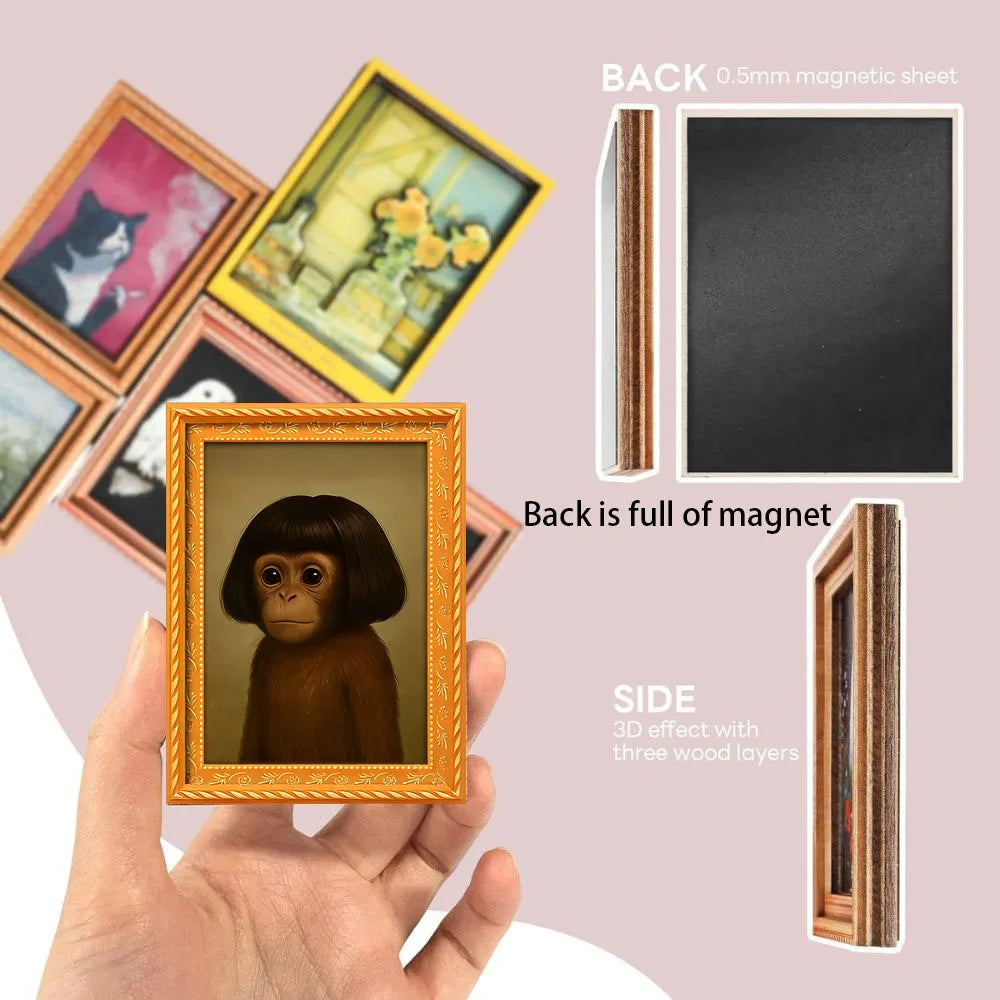 A hand holds a framed picture of a 3D monkey with dark hair, showing the front and back details.