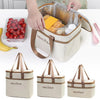 A beige insulated lunch bag is shown open, revealing a clear mesh compartment filled with baked goods and a white container.
