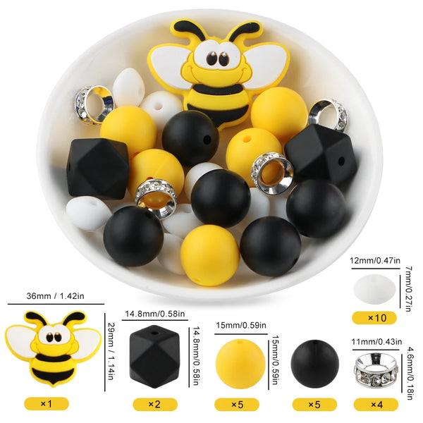 Un tazón blanco lleno de cuentas focales de silicona amarillas y negras con forma de abejas de dibujos animados para hacer jo