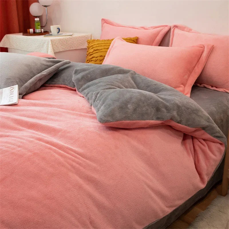 A pink flannel duvet cover with a gray zipper and matching pillows on a bed.