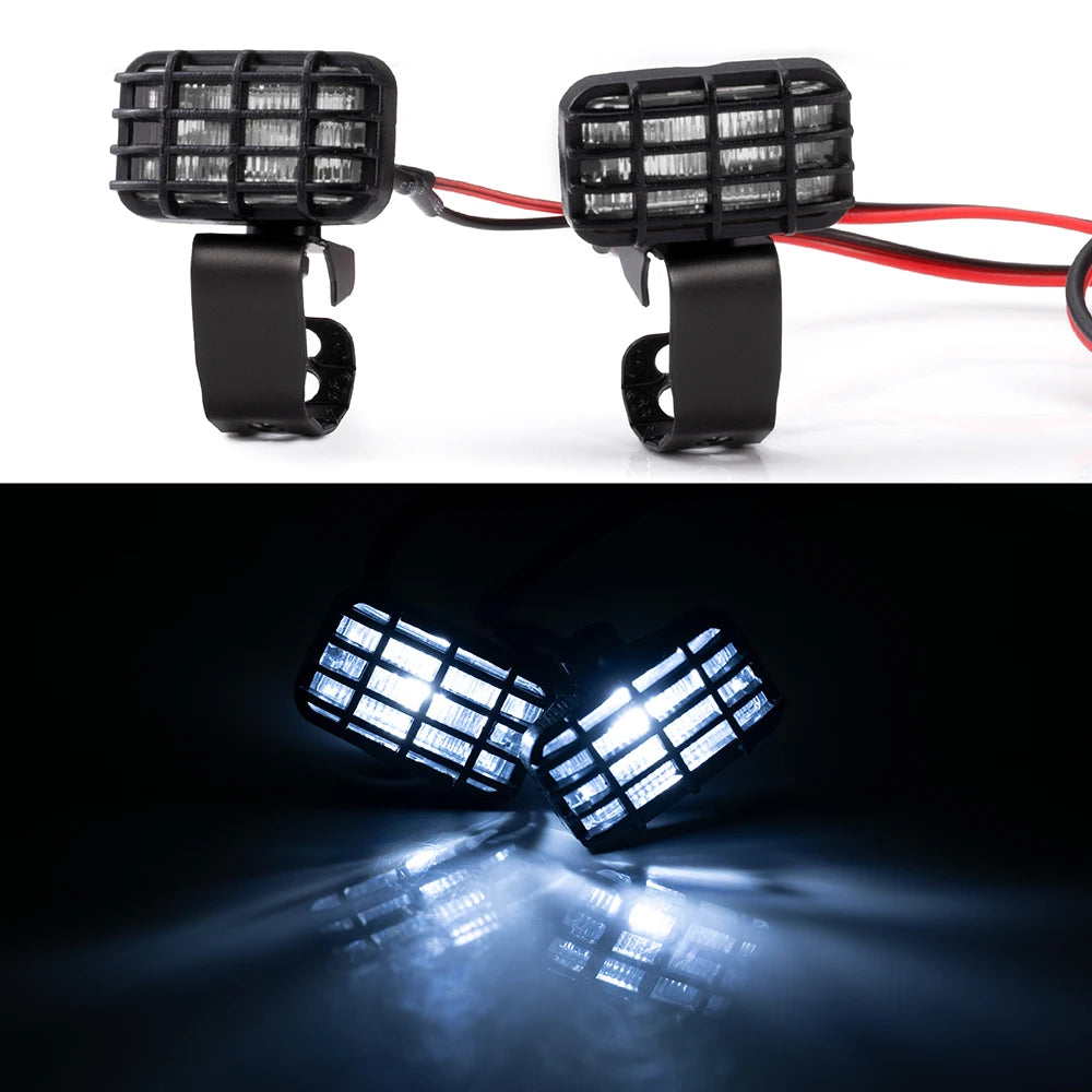 A pair of black LED headlight and spotlight units for RC crawler trucks, showing a bright beam.