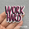 Black and pink embroidered patch with the text WORK HARD on a hand