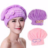 A woman is modeling a purple microfibre quick-dry hair towel wrap with a bowknot, alongside separate purple and pink versions