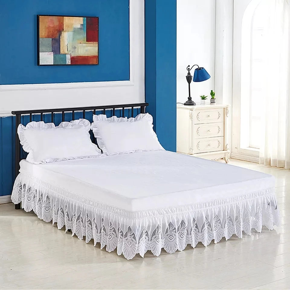 White Jacquard lace bed skirt with elastic band and white bedding displayed in a room.