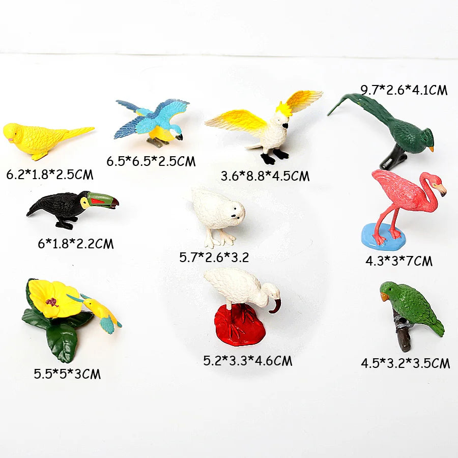 A collection of realistic animal figurines including a yellow bird, blue and yellow bird, white bird, green bird, and pink fl