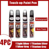 Four touch-up paint pens in various silver and gray colors for car paint repair