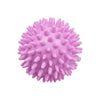 A spherical, pink reusable laundry ball with numerous protrusions for tangle-free washing.