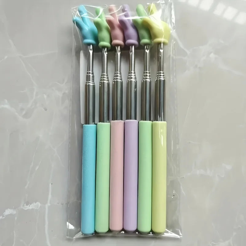 A set of five colorful retractable teacher pointers in shades of blue, green, pink, and purple are displayed in a clear plast