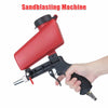 A hand is holding a red handheld pneumatic sandblasting machine with a black grip and nozzle.