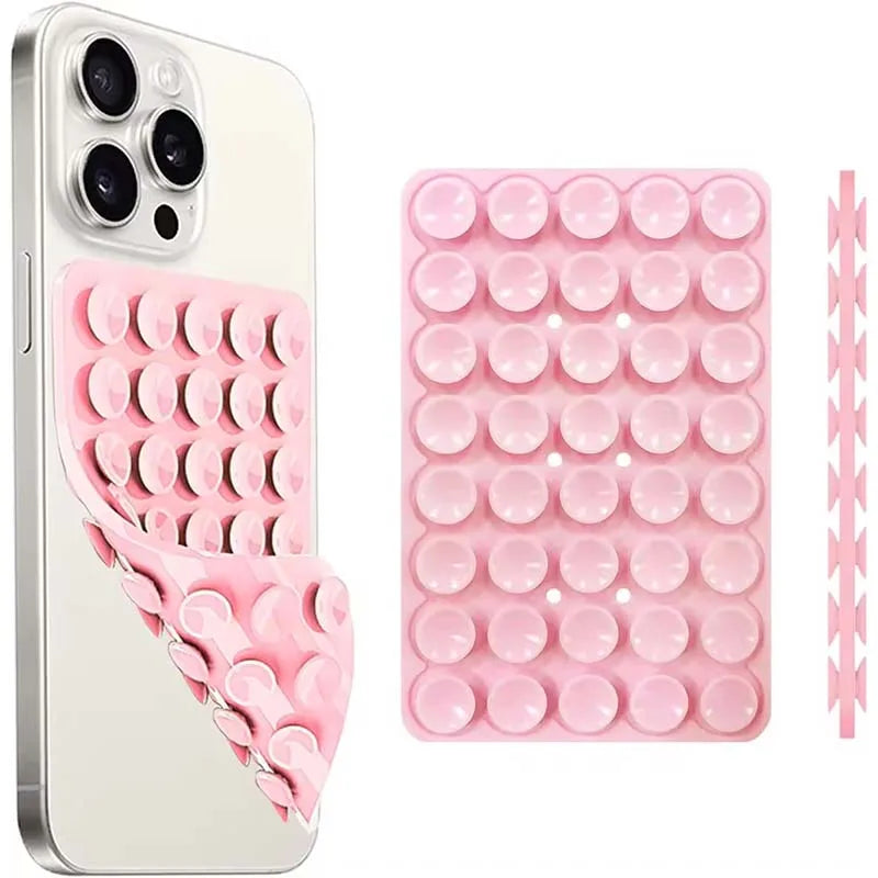 A pink silicone suction cup phone mount with multiple holes for hands-free use.