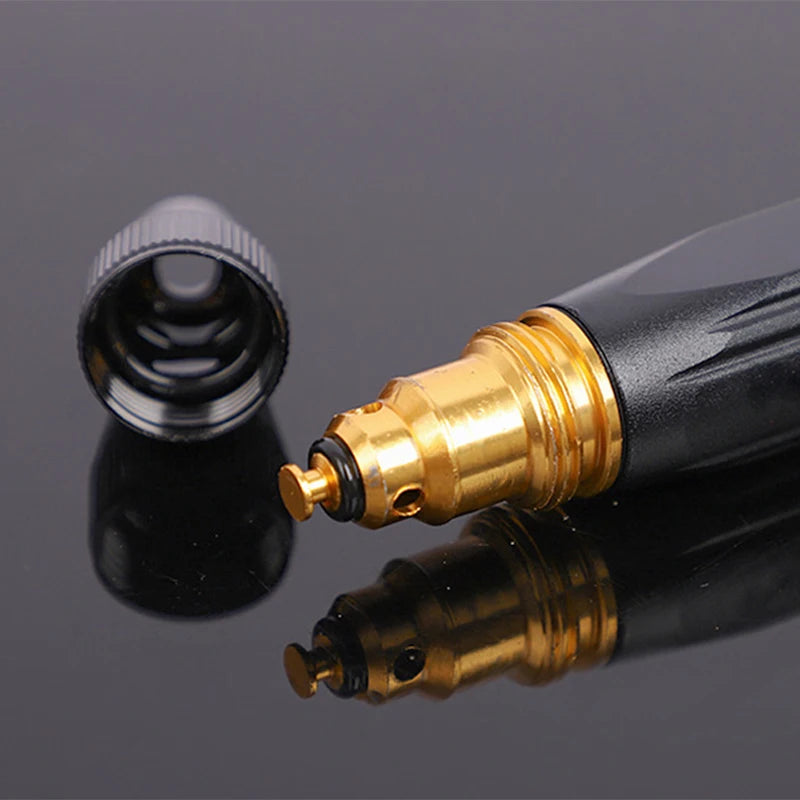 A close-up view of an adjustable high-pressure car wash water gun with a gold nozzle and black body, reflecting on a dark sur