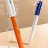 A white and orange pen is shown spraying water, demonstrating the trickery of a water gun pen.