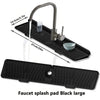 A large black silicone faucet splash pad with a metal faucet and a small bowl shown on a kitchen sink.