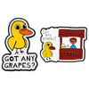 Two enamel lapel pins featuring a yellow duck character asking if someone has any grapes and an ice fresh lemonade drink.