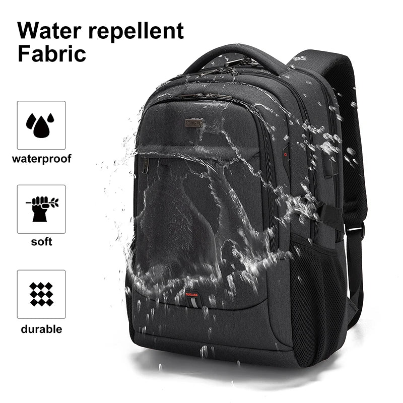 Black water repellent fabric laptop backpack shown with water splashing on it.
