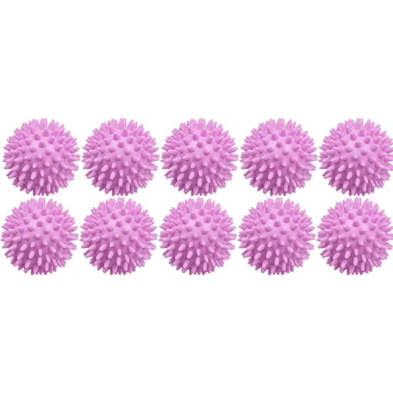 A row of pink reusable laundry balls for tangle-free washing and softening.