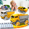 A yellow and gray toy truck is shown driving on a plastic track set with a smiling child in the background.