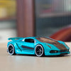A teal 1:64 scale alloy car model with a black hood and racing wheels on a light surface.