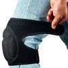 A hand is adjusting a black cushioned knee pad for gardening, work, or sports.