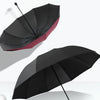 A black and red oversized folding umbrella is shown open against a white background.