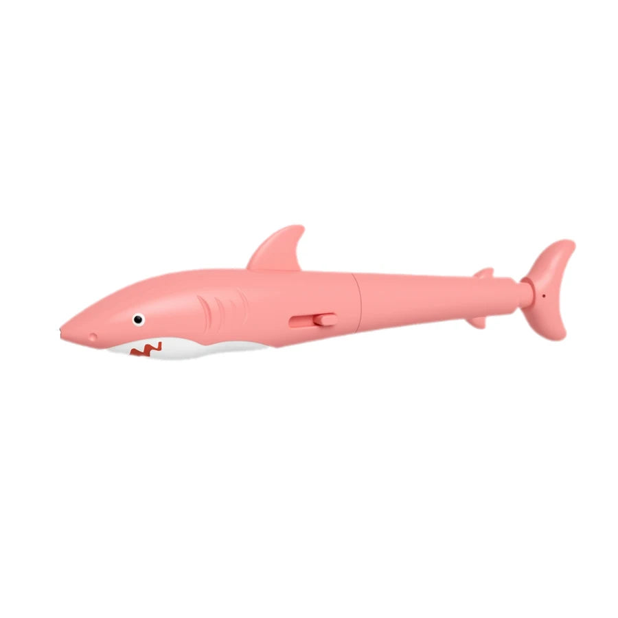 A pink prank water gun pen shaped like a fish, ready to spray water and write.