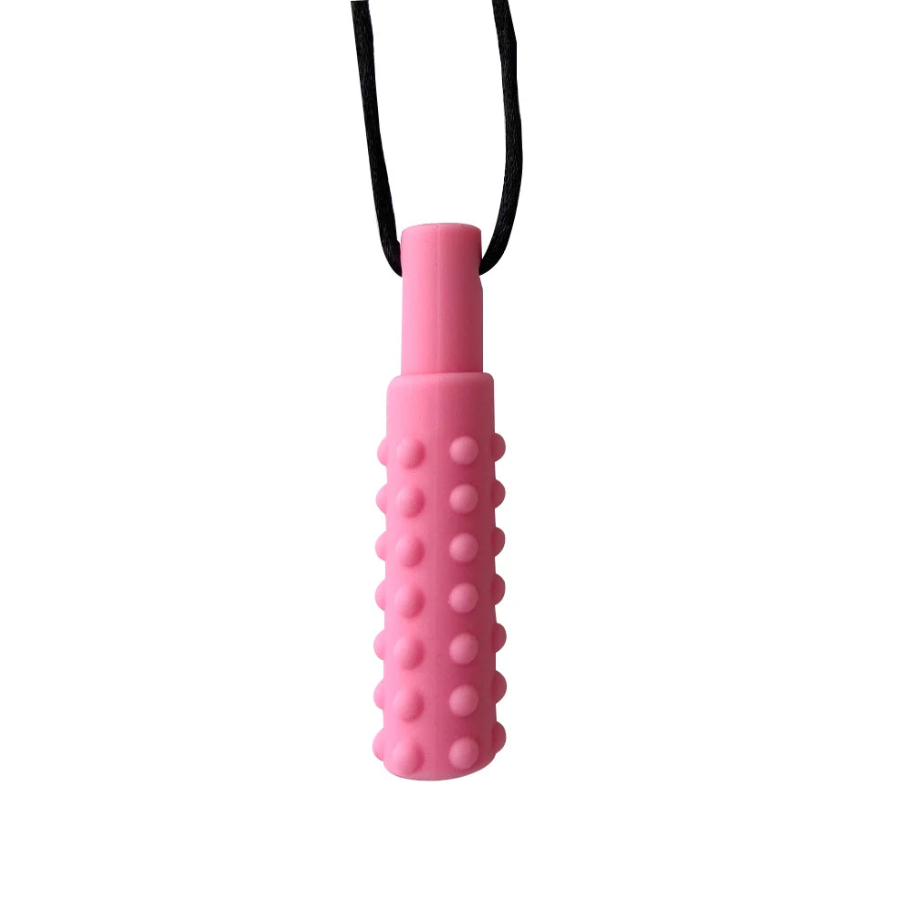 A pink silicone sensory chew necklace pendant with a black cord.