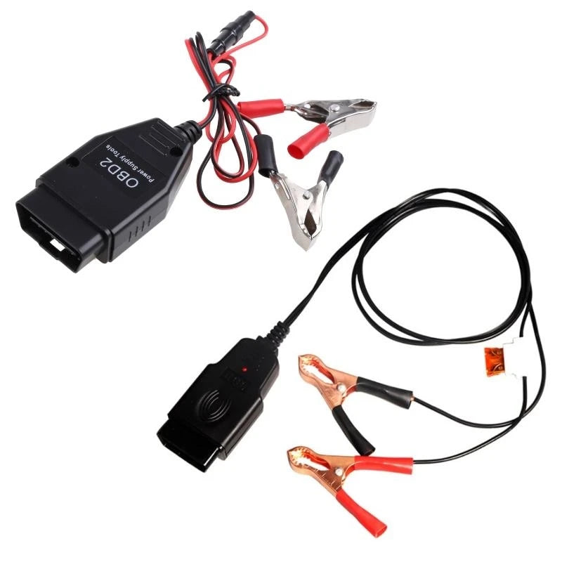 An OBD2 battery memory saver tool with a digital display and attached pliers.