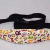 Black adjustable baby car seat sleeping headrest with a patterned fabric strap