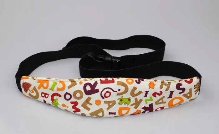 Black adjustable baby car seat sleeping headrest with a patterned fabric strap