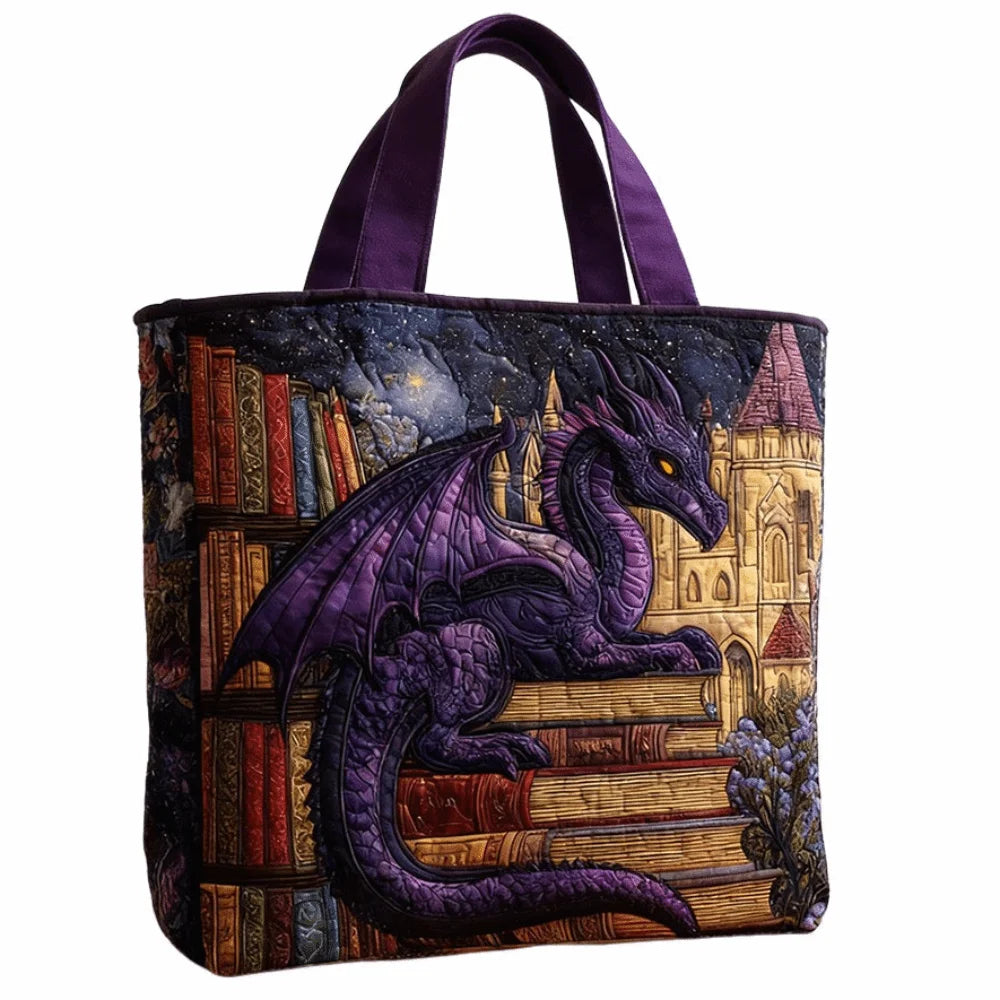 A purple quilted tote bag featuring a detailed illustration of a dragon on a stack of old books.